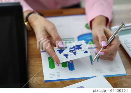 Woman working at financial report Woman working at financial report 64430304