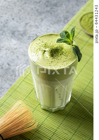 Glass of Dalgona Iced Matcha Latte tea. 64431243