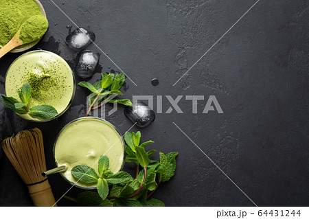 Two glasses of Dalgona Iced Matcha Latte tea. 64431244