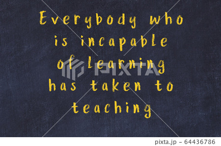 Chalk wise inscription on black chalkboard 64436786