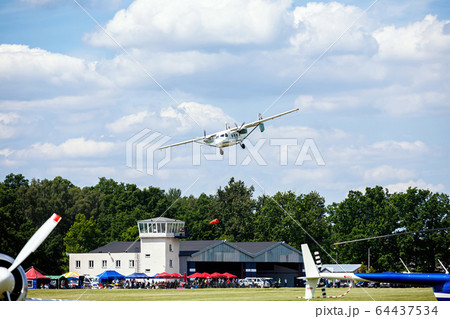 old transport plane flies at an air show old transport plane flies at an air show 64437534
