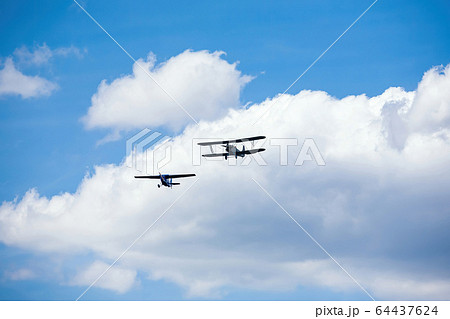 old military aircraft fly at air show 64437624