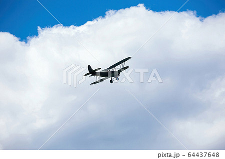old military plane flies at air show 64437648