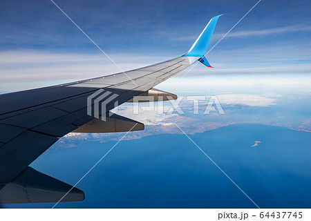 Commercial airplane flying over the Crete island - Greece Commercial airplane flying over the Crete island - Greece 64437745