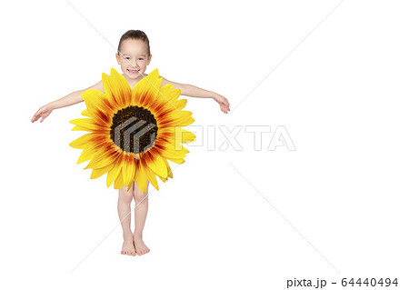 Little blonde girl hiding behind a flower. 64440494