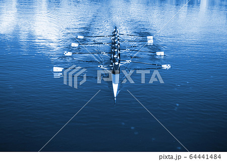 Boat coxed eight Rowers rowing on the tranquil 64441484