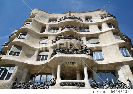 BARCELONA, SPAIN - AUG 30th, 2017: Outdoor view Gaudi's creation-house Casa Mila during a sunny day. BARCELONA, SPAIN - AUG 30th, 2017: Outdoor view Gaudi's creation-house Casa Mila during a sunny day. 64442182