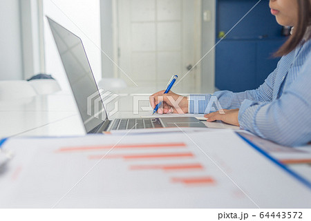 Businesswoman hand writing note Businesswoman hand writing note 64443572