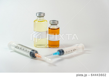 Vaccine bottle with blank label on white background 64443602