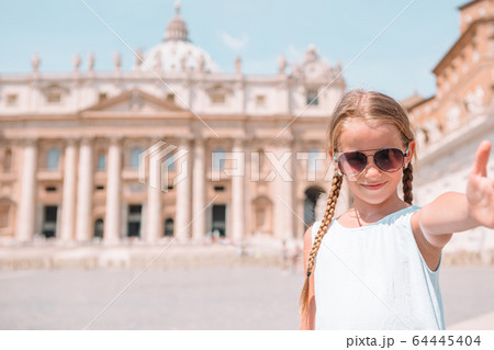 Happy kid at St. Peter's Basilica church in Vatican city. Happy kid at St. Peter's Basilica church in Vatican city. 64445404