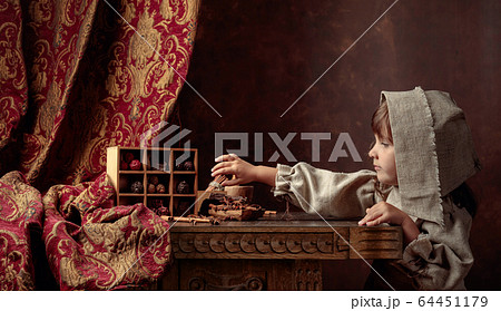 Little girl in an vintage linen dress near the Little girl in an vintage linen dress near the 64451179