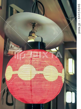 Red and yellow lantern outside shop 64454046