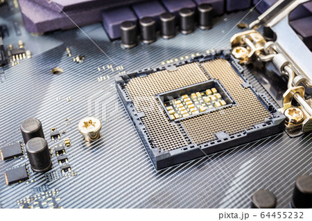 Closeup detail of CPU socket of a modern computer black motherboard. Electronic small component details. Select focus 64455232