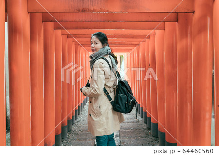 side view of beautiful asian chinese woman walking 64460560