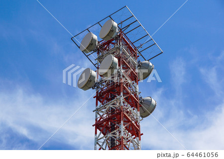Telecommunication tower with a sunlight. Used to transmit television signals. Telecommunication tower with a sunlight. Used to transmit television signals. 64461056