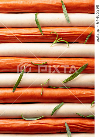 Close-up of sausages sprinkled with rosemary. 64465599