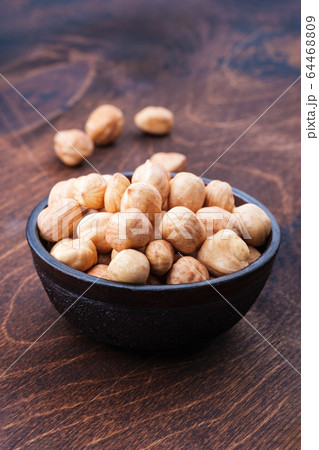 peeled hazelnuts in bowl 64468809