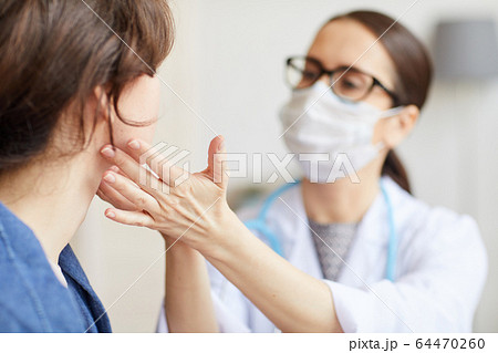 Doctor examining the patient Doctor examining the patient 64470260