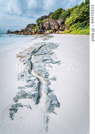 Surreal rock formation leading lines at Grand Anse beach, La Digue island. Scenic landscape at Seychelles island 64470333
