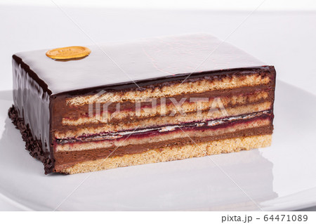 Cut cake with berries, chocolate, berry filling, cows with cream 64471089