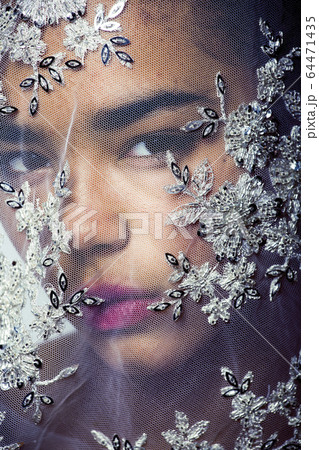 portrait of beauty young afro woman through white lace, like new bride under veil close up portrait of beauty young afro woman through white lace, like new bride under veil close up 64471435