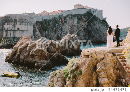 happy honeymoon couple travel europe dubrovnik 64471471