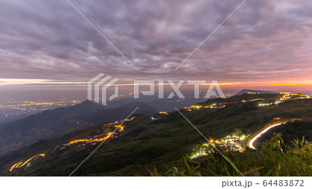 Road in the mountains at night. 64483872