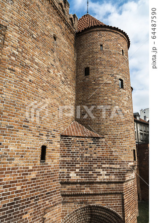 A fragment of the city walls and the Barbican 64487590