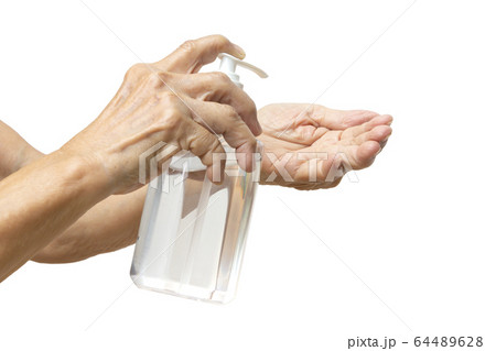 Senior woman's hand is pressing bottle of hand sanitizer gel pump dispenser to wash her hands in grey background, Close up shot, Select focus, Prevention from covid19, Bacteria, healthcare concept Senior woman's hand is pressing bottle of hand sanitizer gel pump dispenser to wash her hands in grey background, Close up shot, Select focus, Prevention from covid19, Bacteria, healthcare concept 64489628