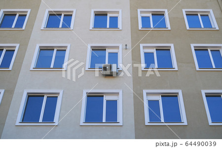 one air conditioner outside unit on a facade of 64490039