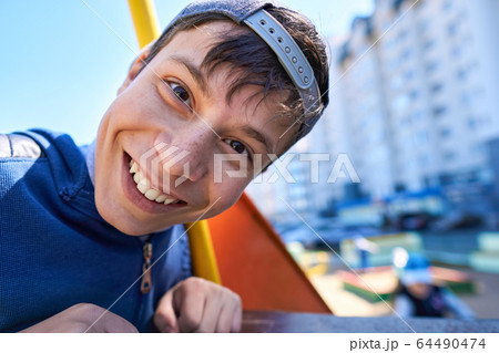 Portrait of children playing on the playground Portrait of children playing on the playground 64490474