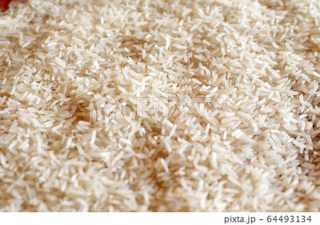 Uncooked asian white rice or Long white rice grain Uncooked asian white rice or Long white rice grain 64493134