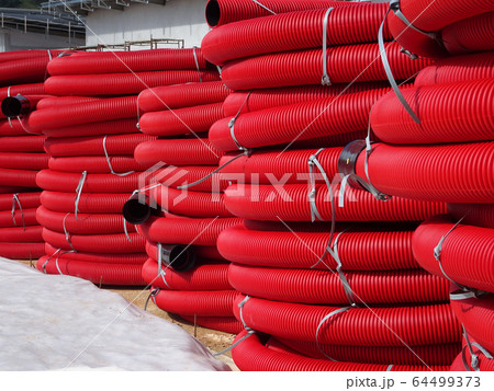 HDPE corrugated pipe with double-wall strength at the construction site. Used to protect underground cable. 64499373