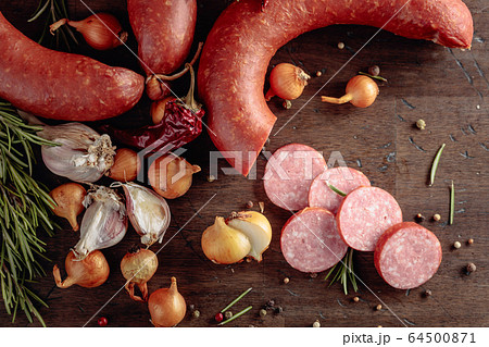 Salami with rosemary, onion, garlic and pepper on Salami with rosemary, onion, garlic and pepper on 64500871