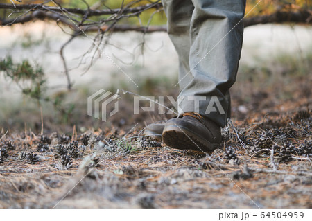 Feet of tourist man casual boots look Feet of tourist man casual boots look 64504959