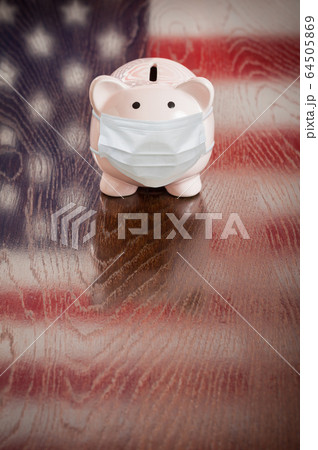 Piggy Bank Wearing Medical Face Mask With American Flag Piggy Bank Wearing Medical Face Mask With American Flag 64505869