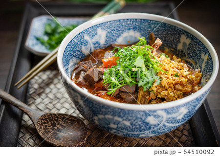 Rice noodles with spicy pork sauce (Nam ngiao) Rice noodles with spicy pork sauce (Nam ngiao) 64510092