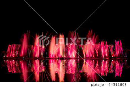 The colorful fountain dancing in celebration of year with dark night sky background. 64511693