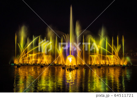 The colorful fountain dancing in celebration of year with dark night sky background. 64511721