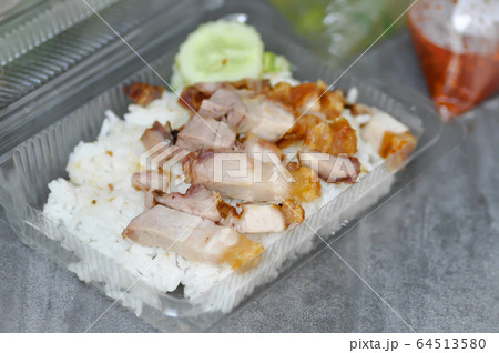 crispy pork with rice, rice topped with crispy 64513580