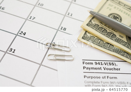 IRS Form 941-V Payment Voucher blank lies with pen 64515770