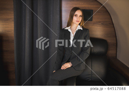 Attractive woman in private jet Attractive woman in private jet 64517088