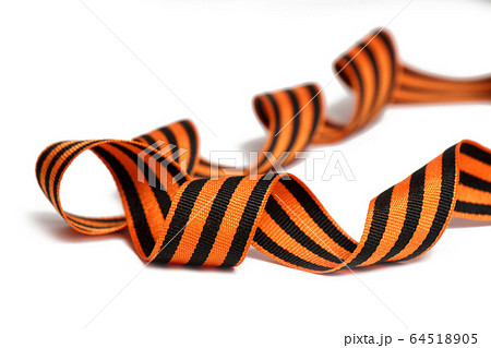 Orange-black St. George ribbon on a white background 64518905