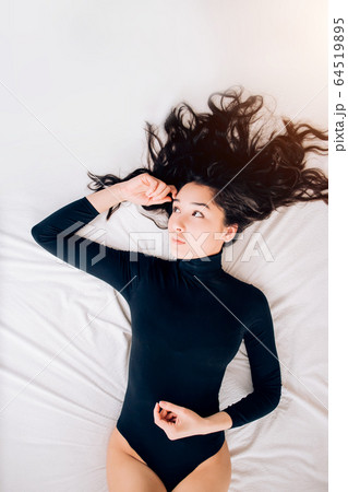 Portrait pretty sexy young woman on bed Portrait pretty sexy young woman on bed 64519895