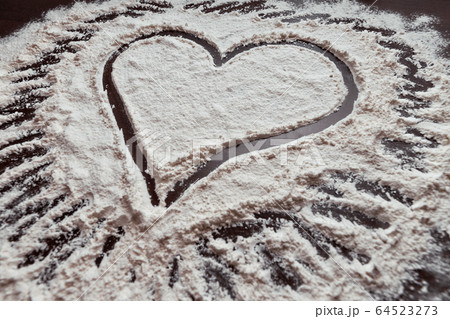 hand drawn heart on table sprinkled with 64523273