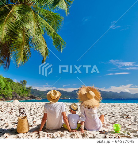Family with three year old boy on beach. Family with three year old boy on beach. 64527048