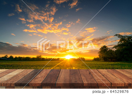 Rice field sunset and Empty wood table for product Rice field sunset and Empty wood table for product 64529876