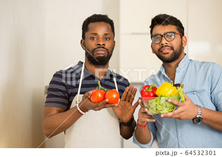Handsome men standing in kitchen 64532301