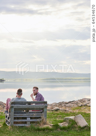 Friends Resting By Lake Friends Resting By Lake 64534670