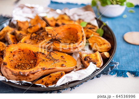 Close up baked roasted grilled whole orange Close up baked roasted grilled whole orange 64536996